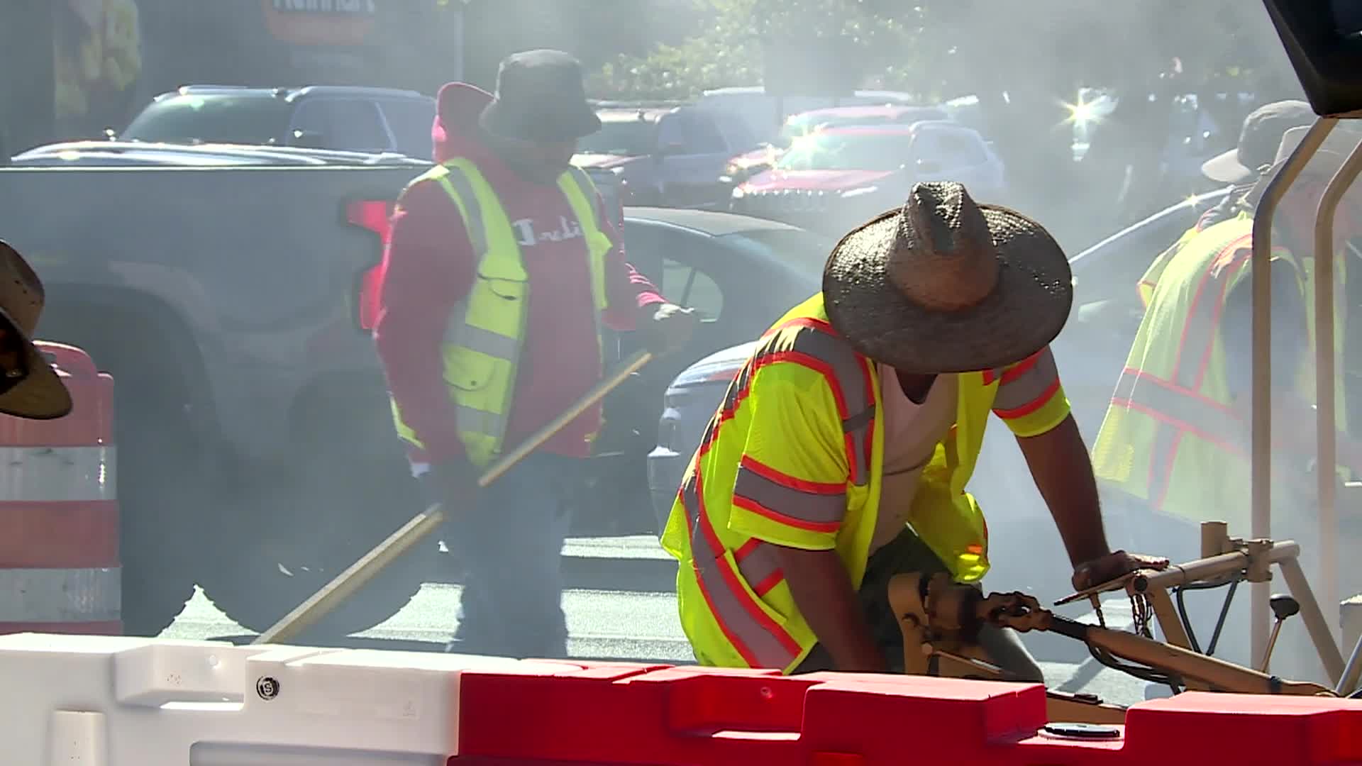 men laying new asphalt for road 