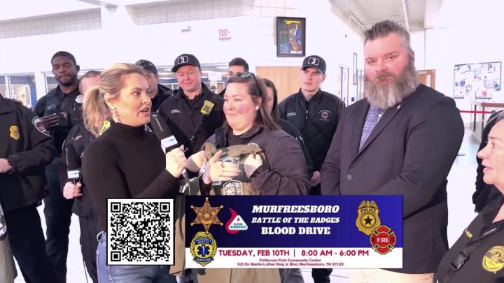 group of people talking about battle of the badges blood drive