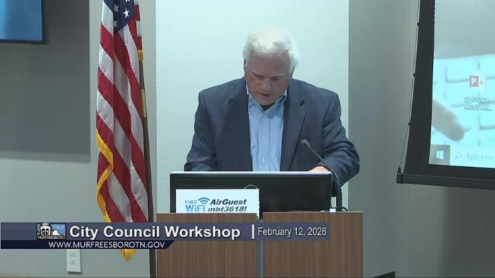 Shot of presenter discussing financial audit report