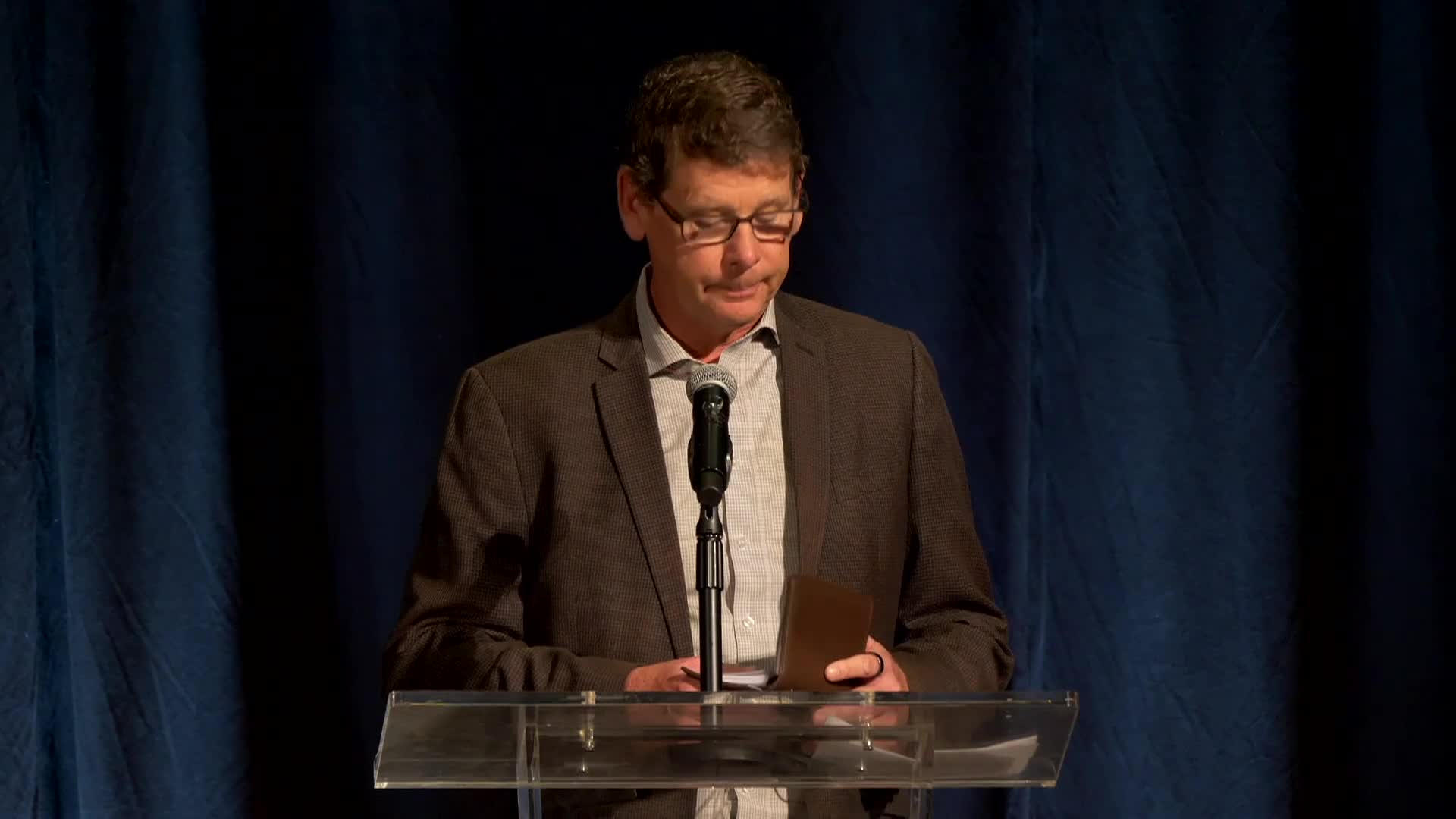 Someone speaking at a podium