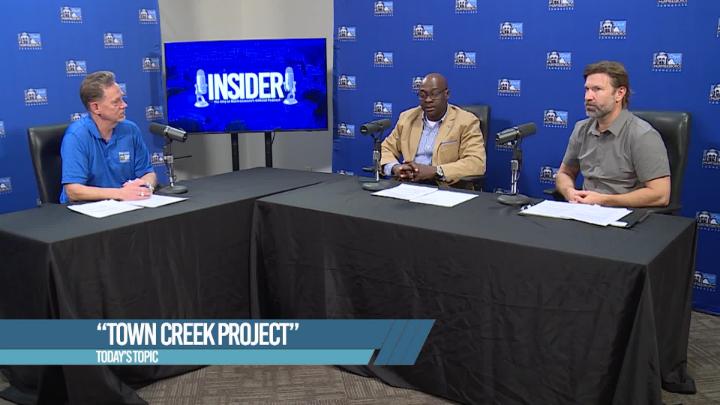 Three men talking on a podcast about Town Creek